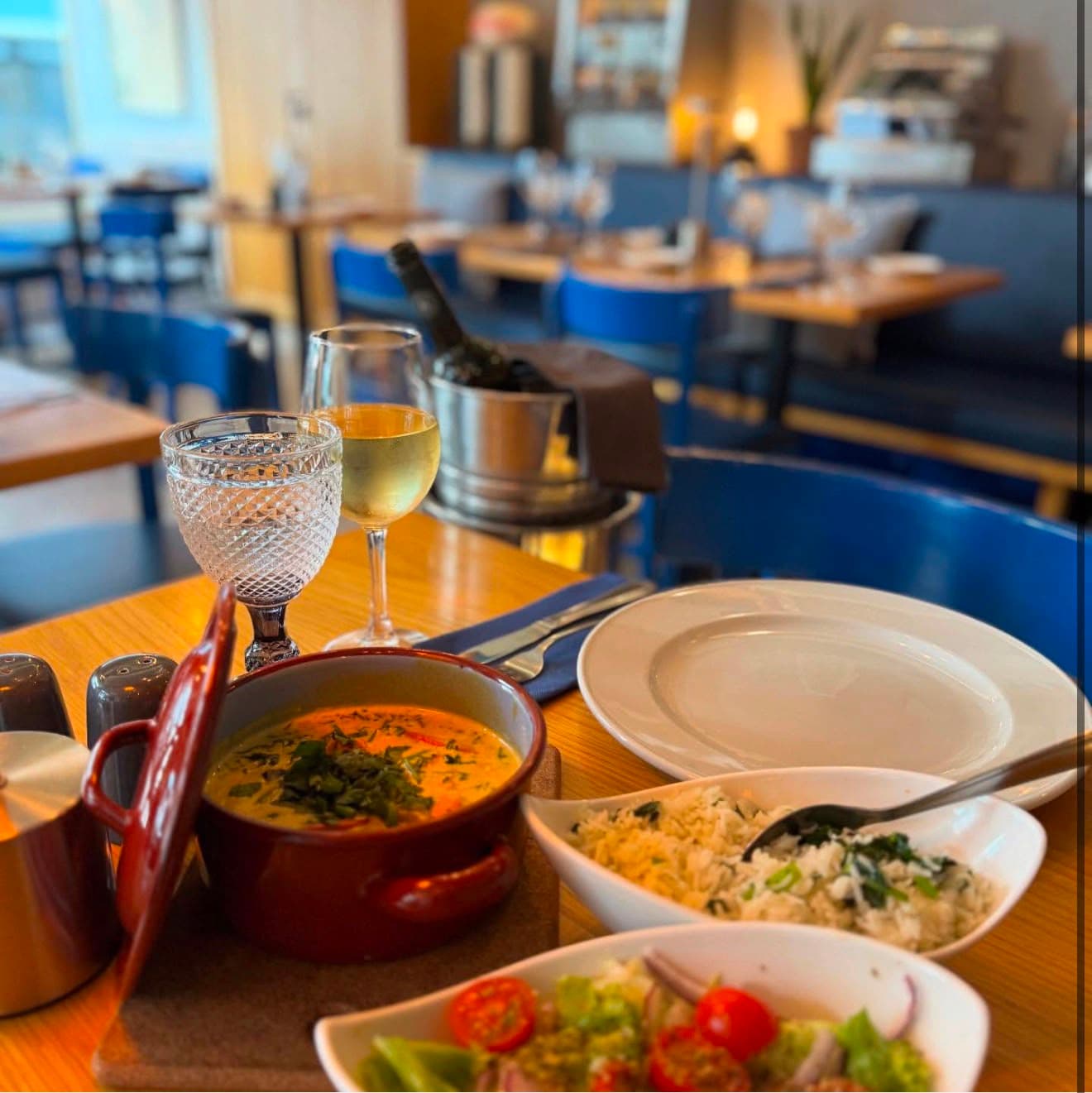 Portuguese dishes served at a table inside Leitaria da Anunciada